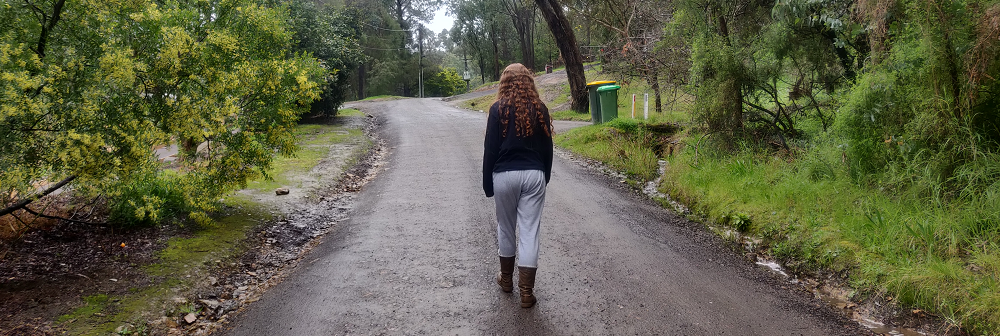 A person walking down a road.