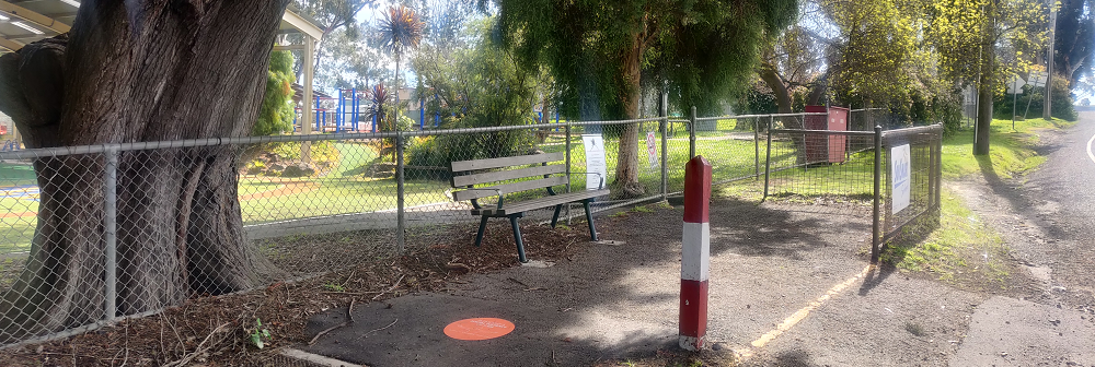 A bench on a public path.